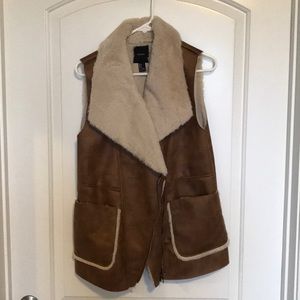 Faux leather vest with zip up front, bucket pocket